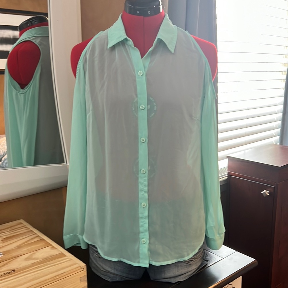 Sheer button down shirt with exposed shoulders.